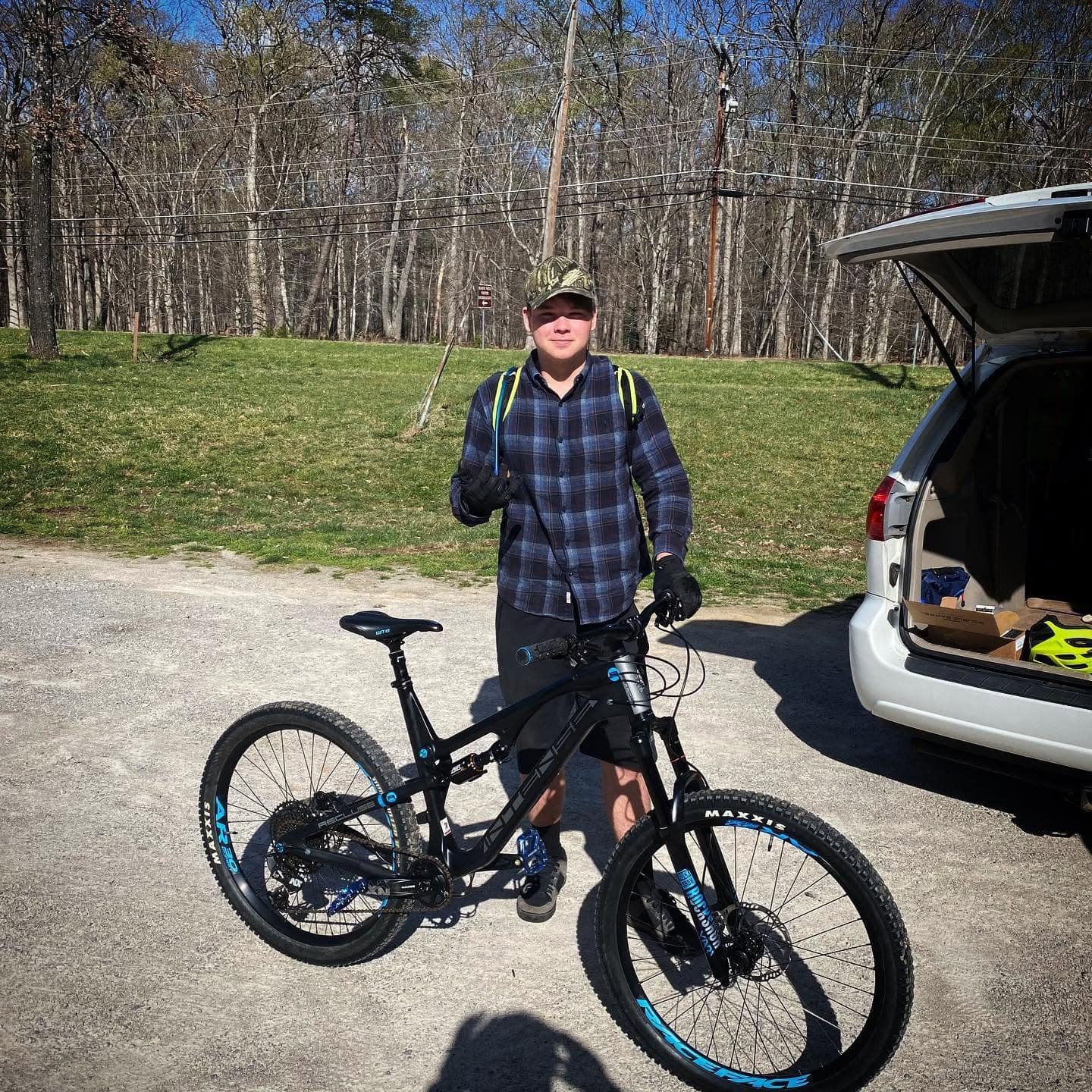 Rider picking up his freshly built full-suspension mountain bike